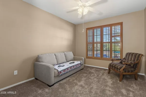 a bedroom with a bed and a lamp
