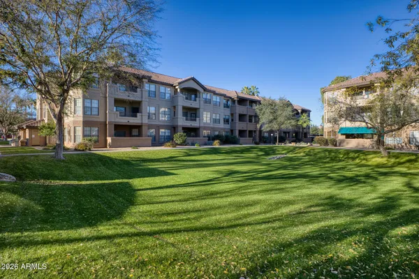 a view of a building with a big yard