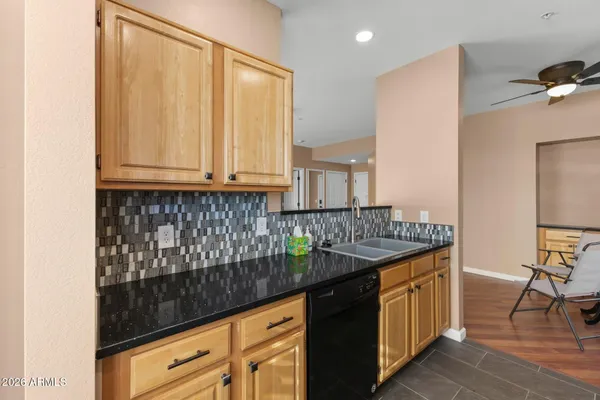 a kitchen with stainless steel appliances granite countertop a stove a microwave and a refrigerator