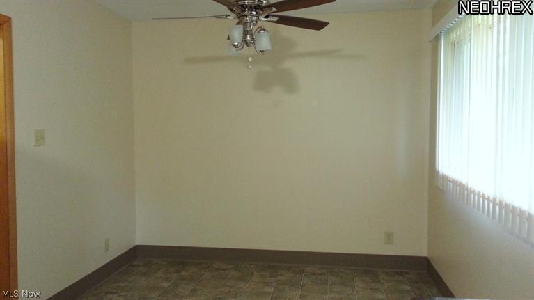 1998 Wyndham Road Akron, OH 44313 - Photo 9 of 25 Large enough for table and chairs. Ceiling fan/light combo. To the left, a half bath, entrance to garage and finished lower level.