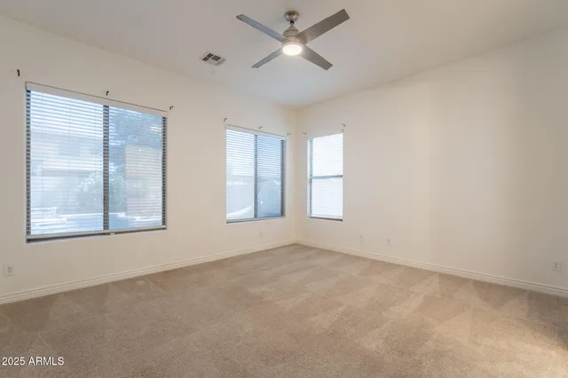 a living room with fireplace furniture and a chandelier