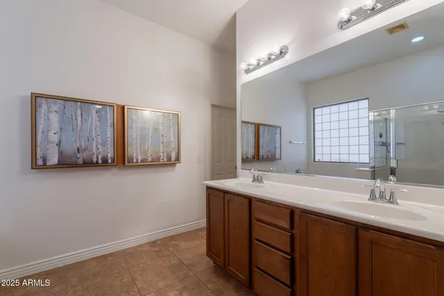 a kitchen with stainless steel appliances granite countertop a sink a stove oven and refrigerator