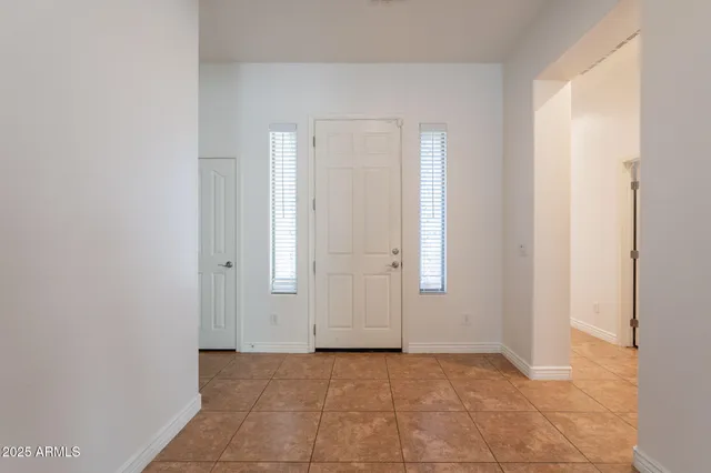 a view of a porch with a table and chairs