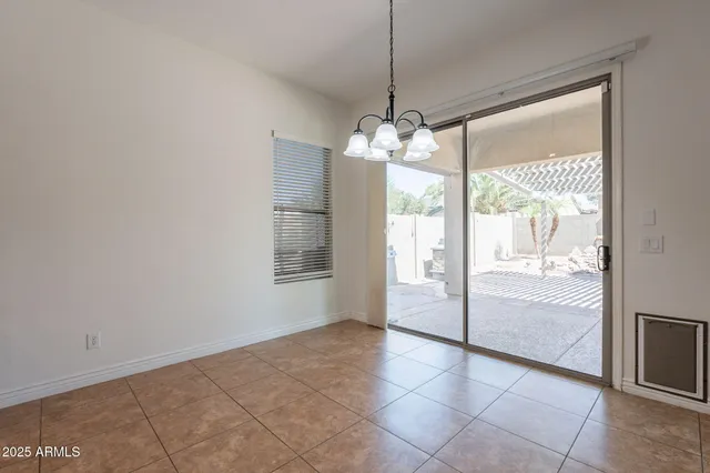 a view of a room window and wooden floor