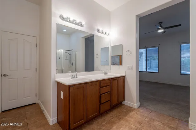 a kitchen with granite countertop a sink a stove and refrigerator