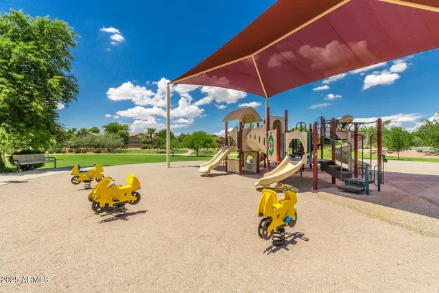 a swimming pool with outdoor seating and yard
