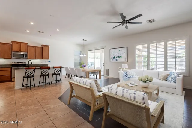 a view of a kitchen with furniture and a ceiling fan