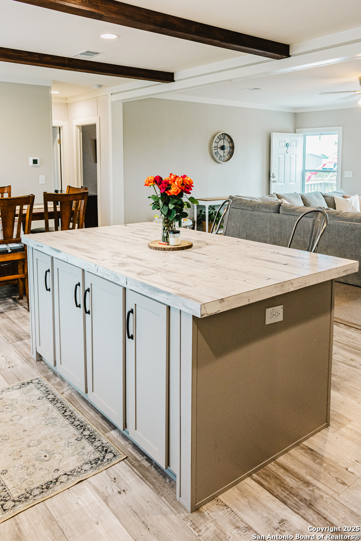 342 PR 4653 Hondo, TX 78861 - Photo 16 of 35 a room with kitchen island a sink wooden floor and glass top space