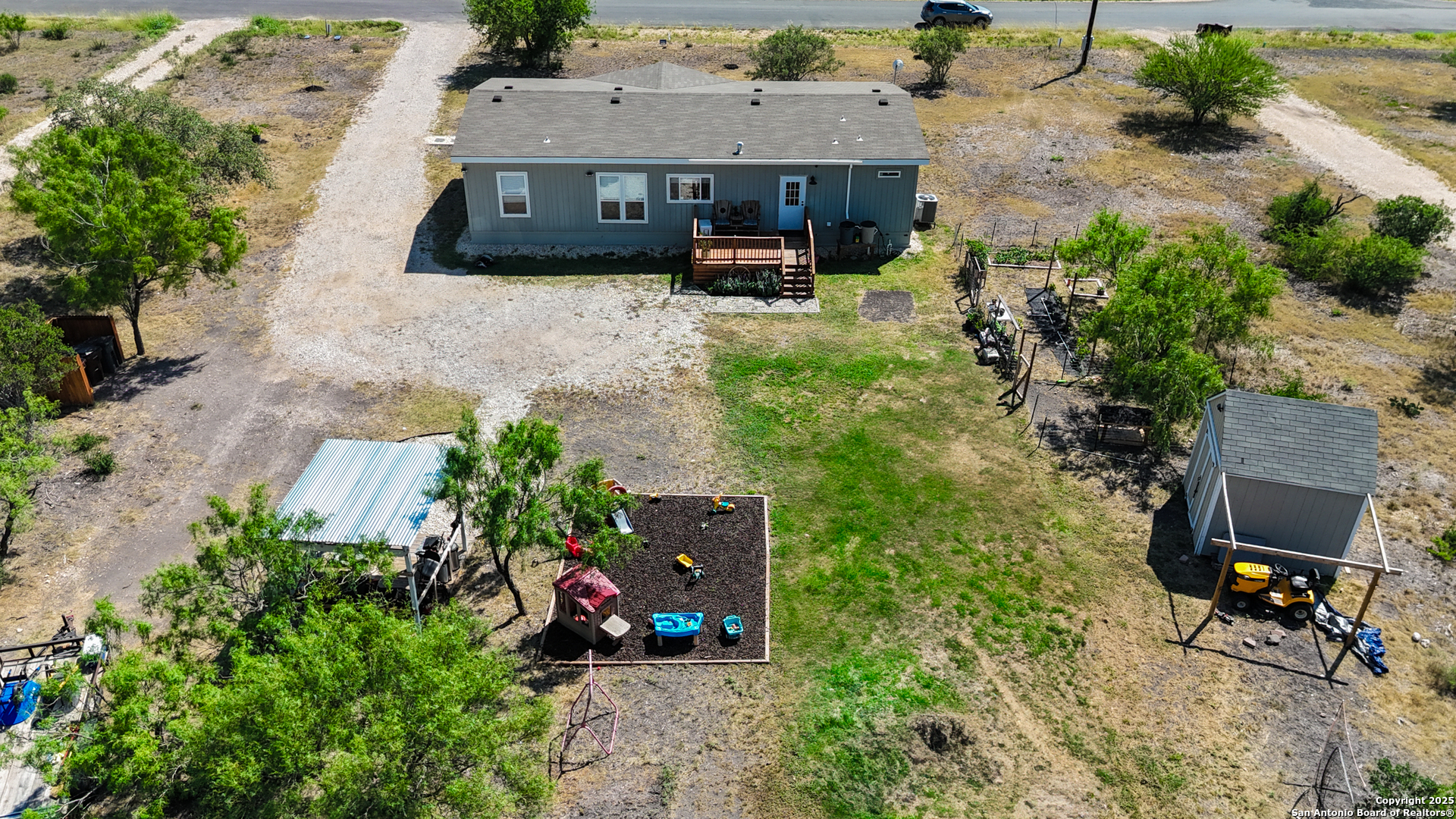 342 PR 4653 Hondo, TX 78861 - Photo 2 of 35 an aerial view of a house with a garden