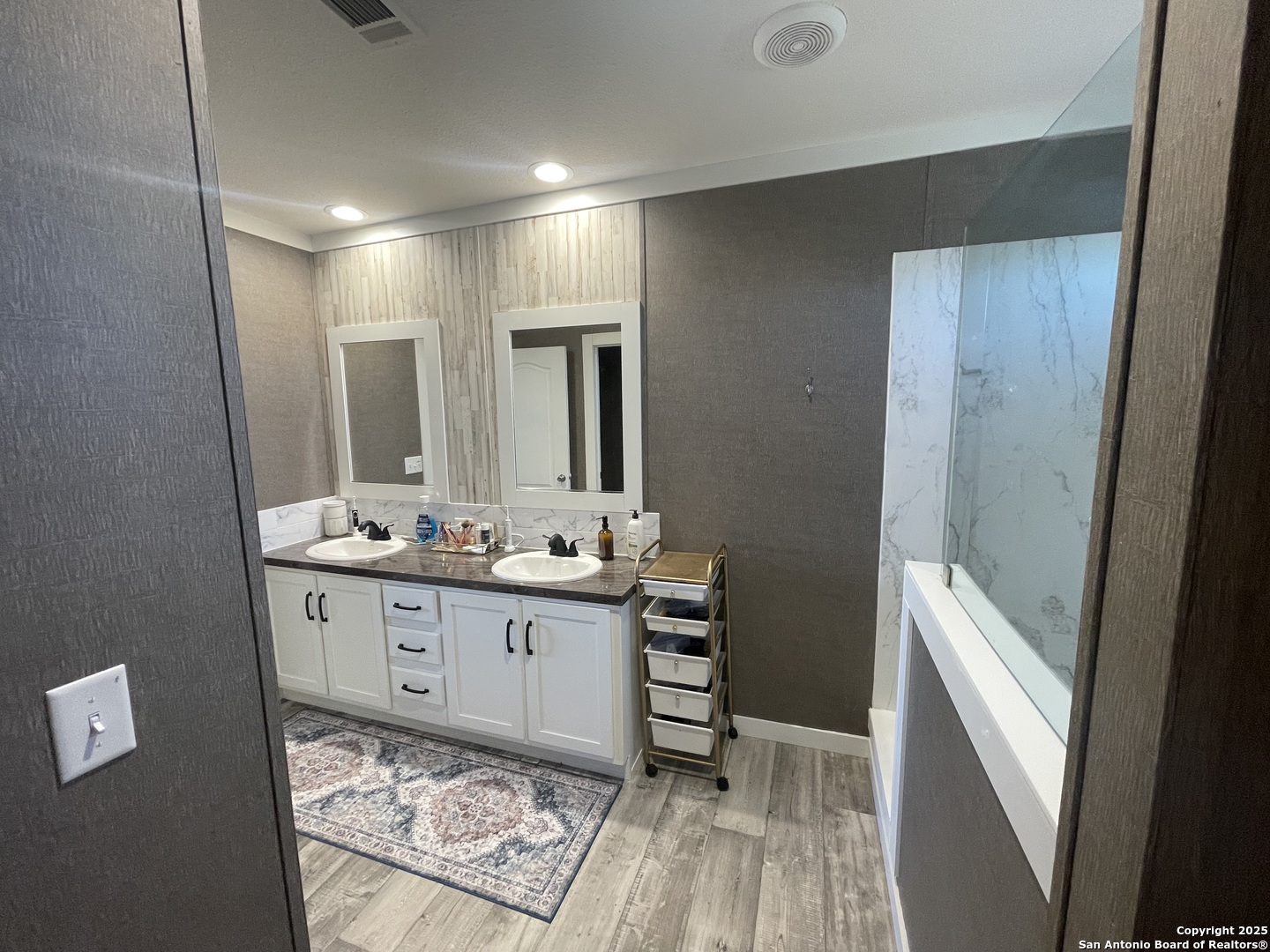 342 PR 4653 Hondo, TX 78861 - Photo 26 of 35 a bathroom with double vanity sink and mirror