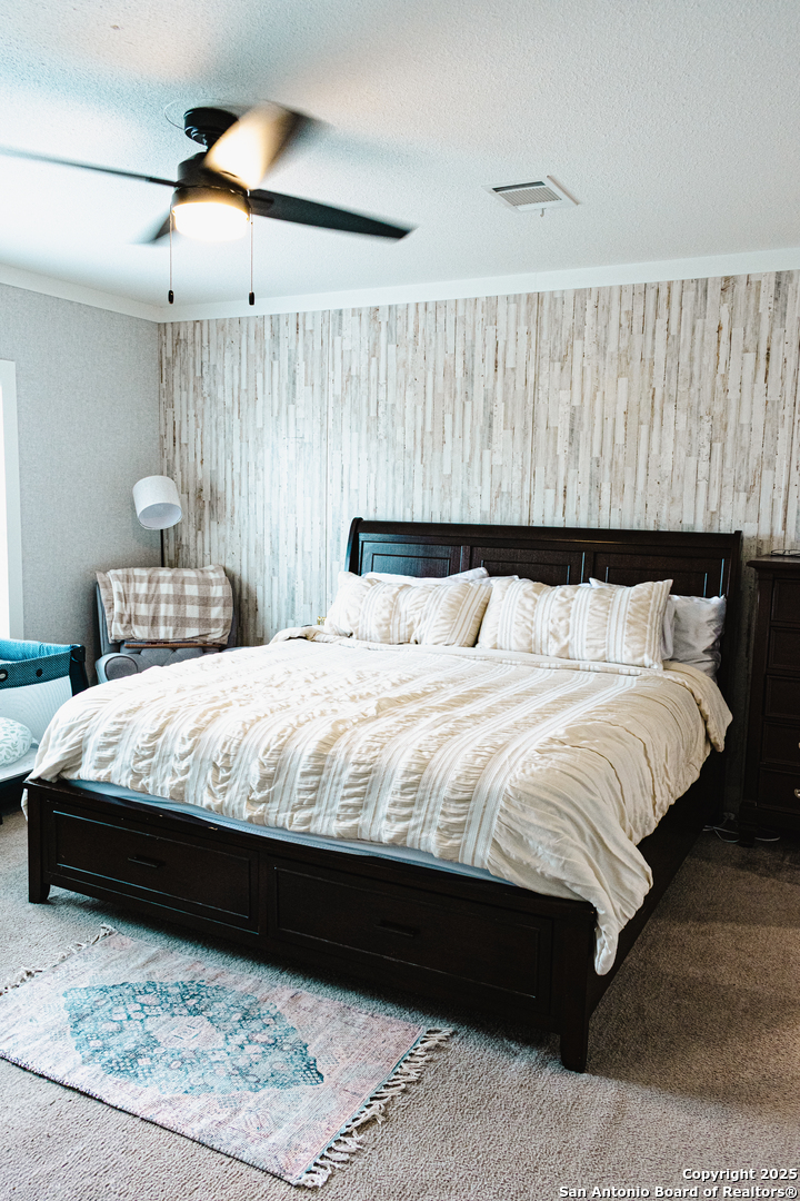 342 PR 4653 Hondo, TX 78861 - Photo 27 of 35 a bedroom with a bed and a night stand