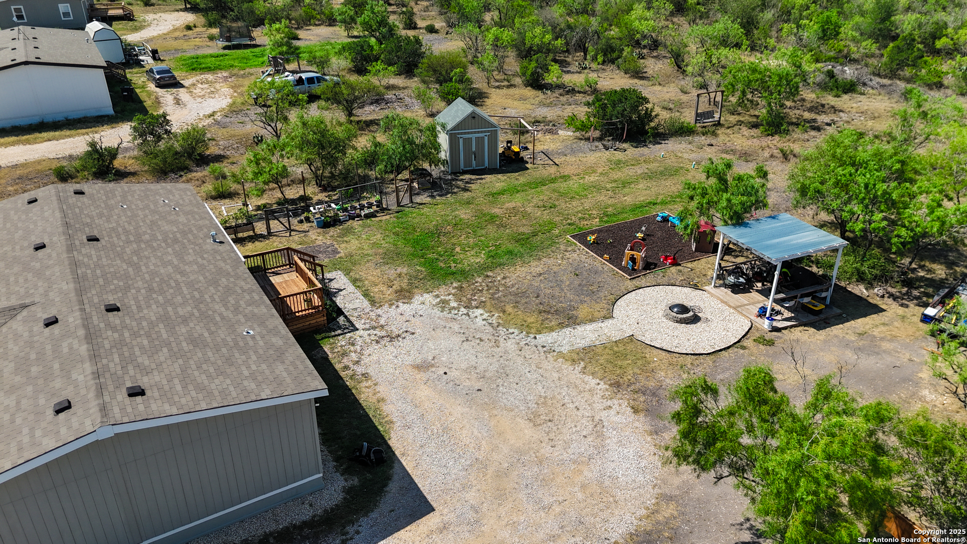 342 PR 4653 Hondo, TX 78861 - Photo 3 of 35 an aerial view of a house with table and chairs