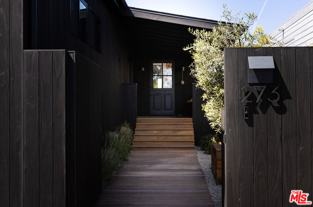 a view of a entryway door with wooden floor