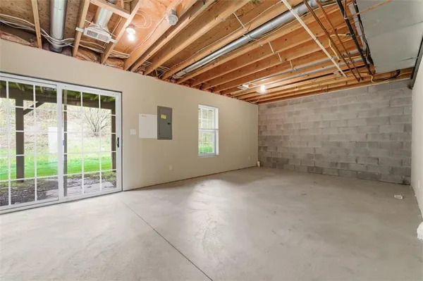 a view of an empty room with windows