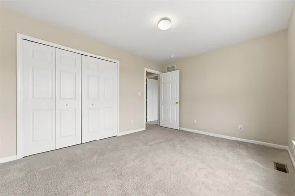 a view of an empty room and entryway