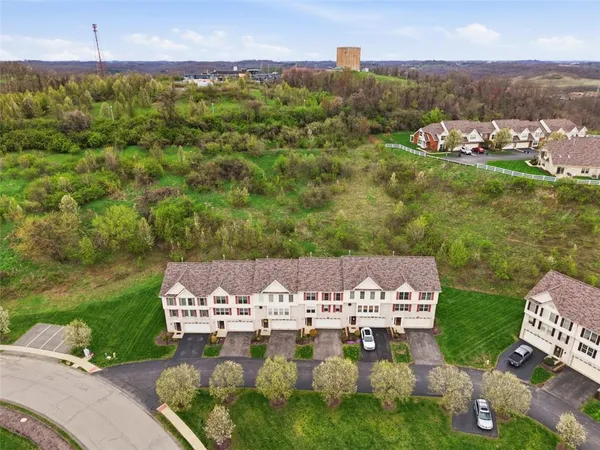 an aerial view of a house with a garden