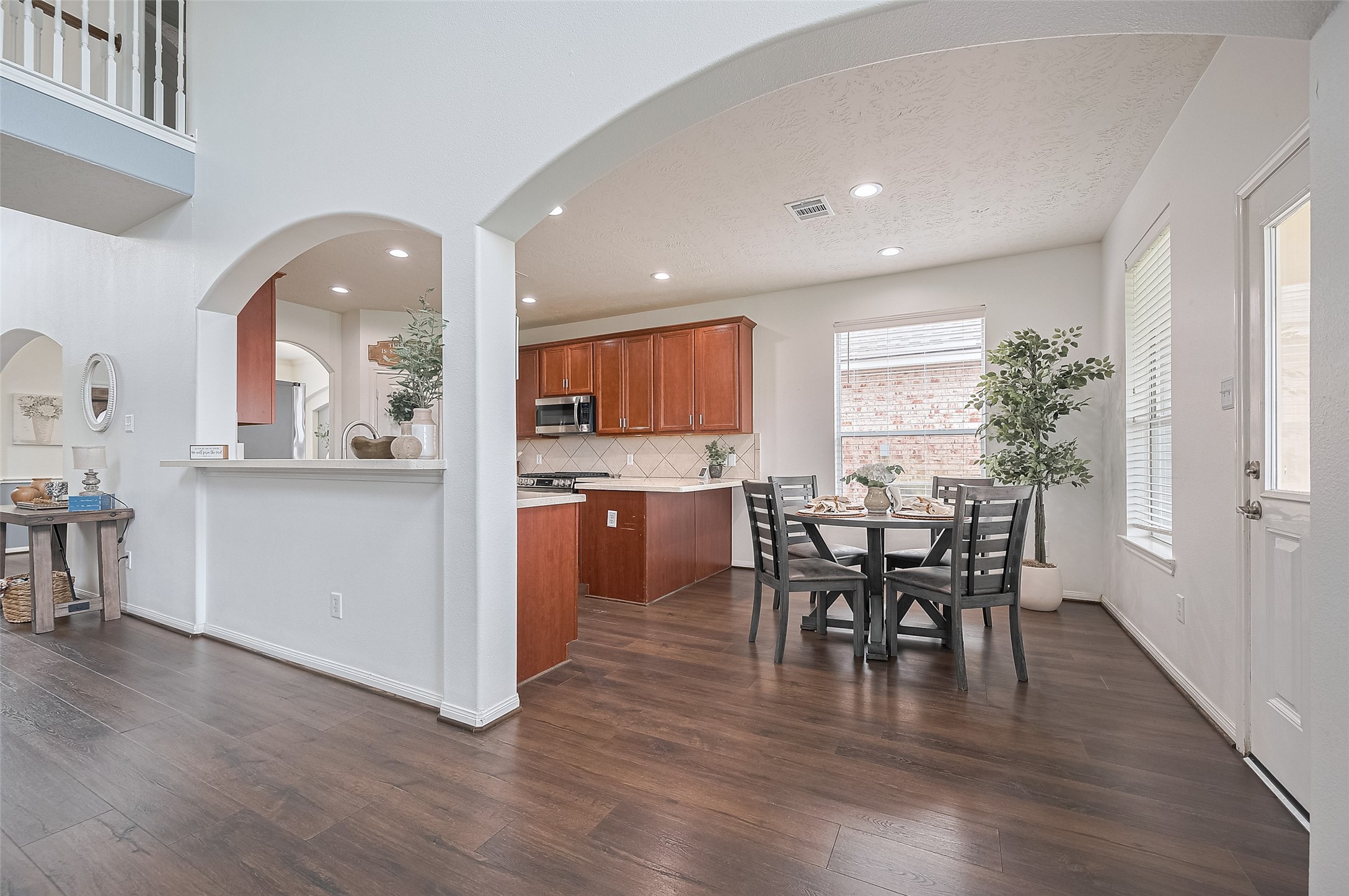 21506 Avalon Queen Drive Spring, TX 77379 - Photo 19 of 46 Designed for connection, the open layout features a convenient breakfast bar and flows seamlessly into the sunny casual dining area.