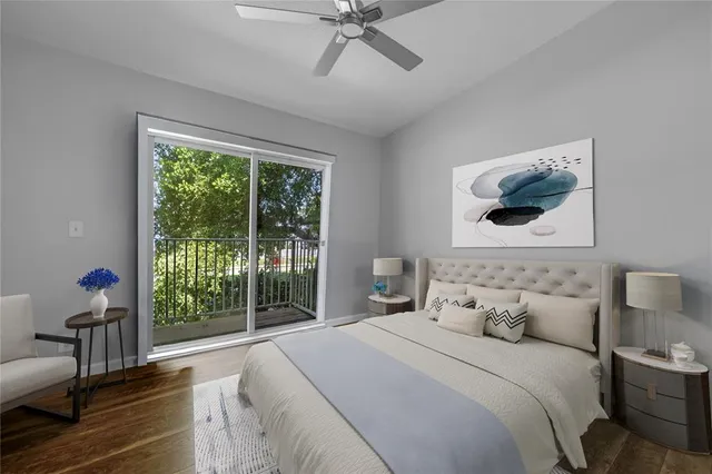 a bedroom with a large bed and a window