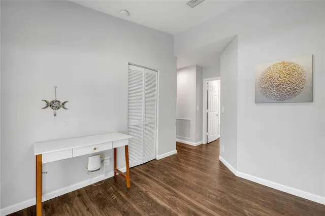 a view of a livingroom with wooden floor