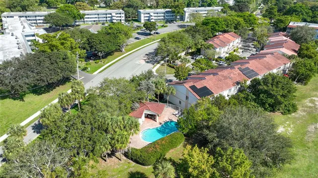 an aerial view of a house with a garden