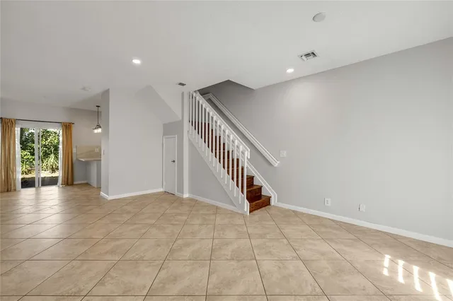 a view of an entryway with wooden floor
