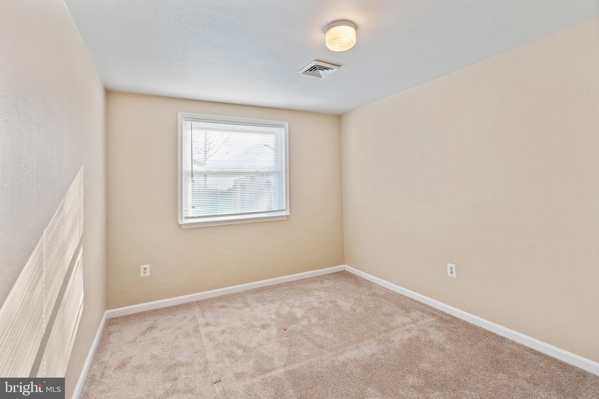 1224 Guildford Road Glen Burnie, MD 21060 - Photo 13 of 22 an empty room with windows