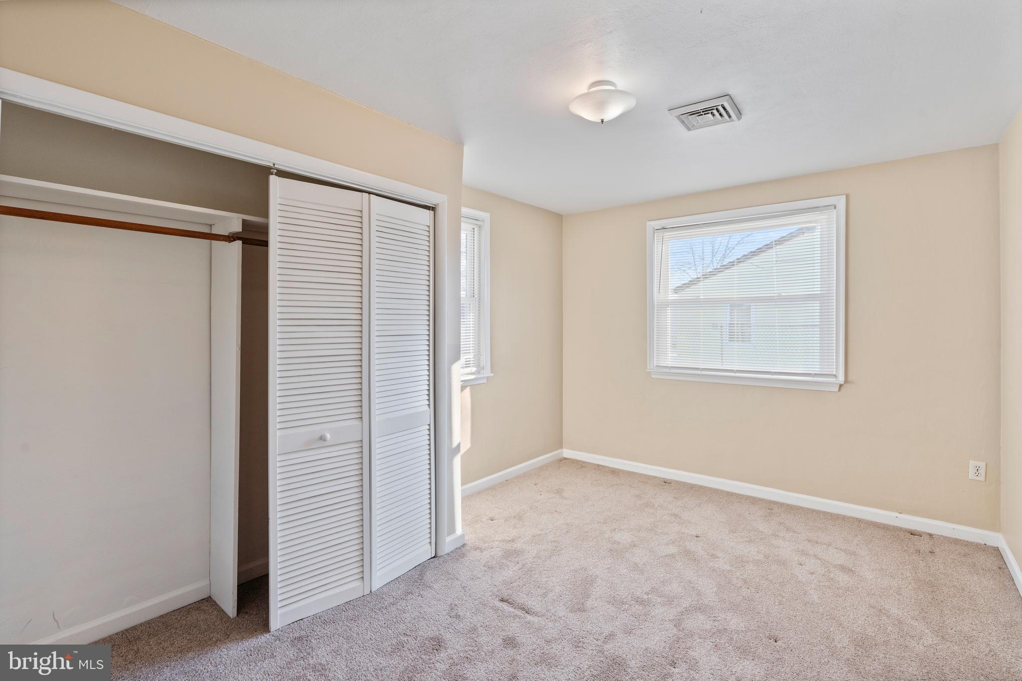 1224 Guildford Road Glen Burnie, MD 21060 - Photo 16 of 22 an empty room with windows and closet