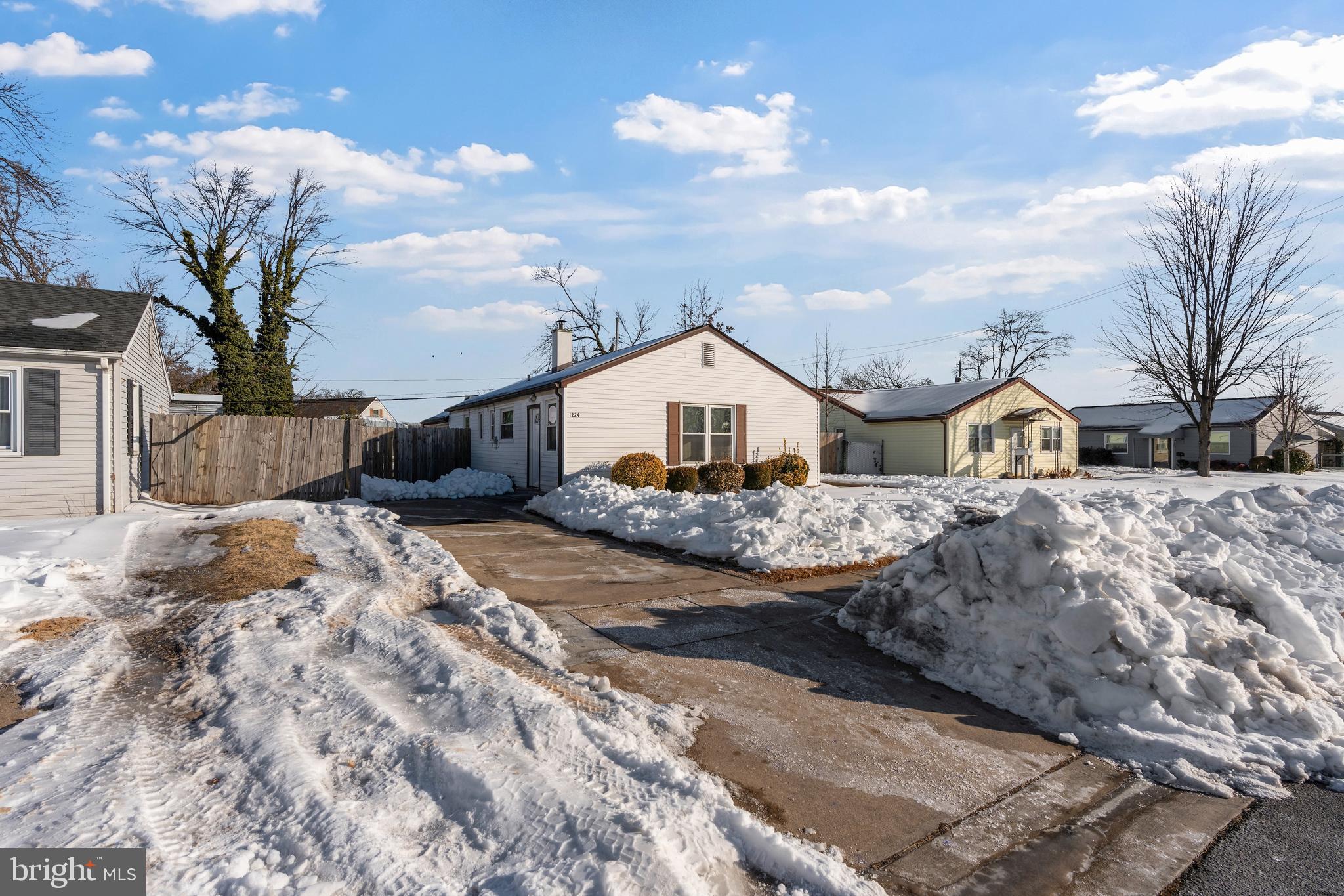 1224 Guildford Road Glen Burnie, MD 21060 - Photo 21 of 22 a view of a house with snow on the road
