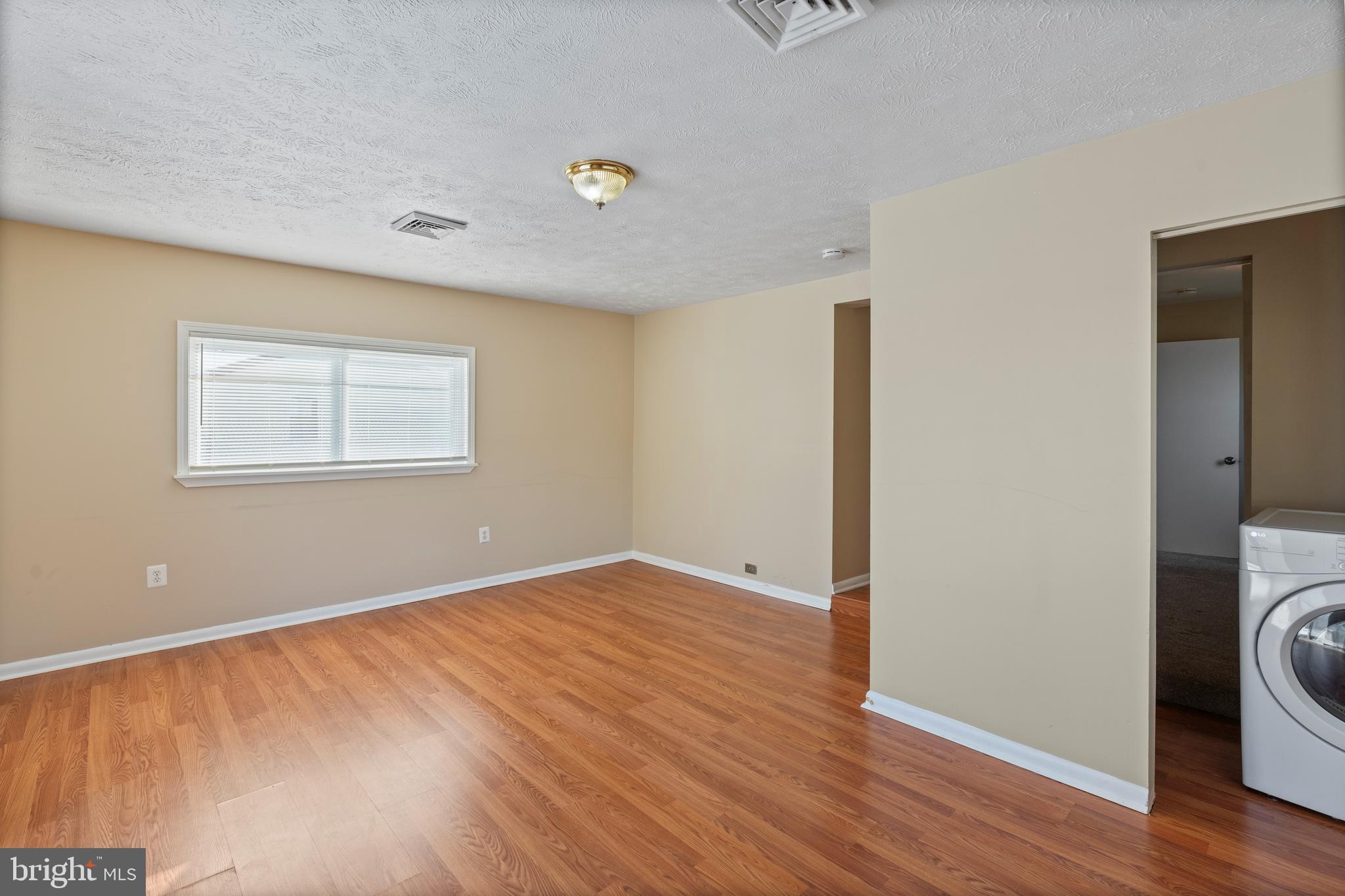 1224 Guildford Road Glen Burnie, MD 21060 - Photo 5 of 22 a view of a room with wooden floor and sink