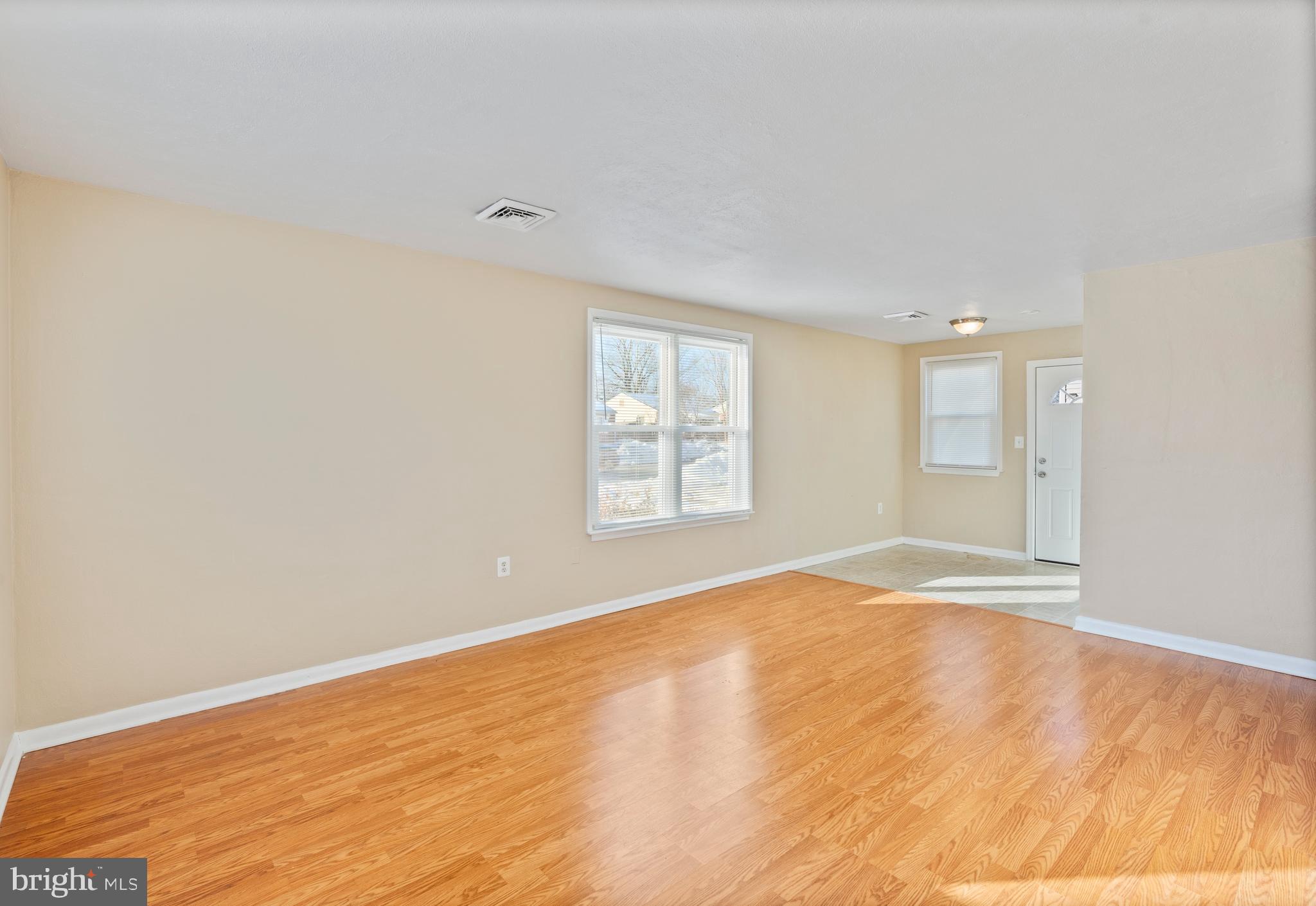1224 Guildford Road Glen Burnie, MD 21060 - Photo 10 of 22 a view of empty room with wooden floor and fan
