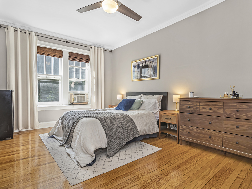 815 Brummel Street, Unit 2 Evanston, IL 60202 - Photo 10 of 16 a bedroom with a bed and a window