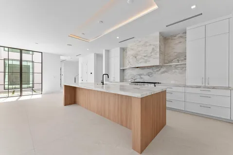 a close view of a sink and a dryer in a utility room