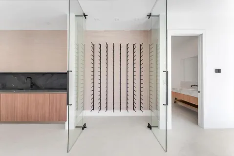 an aerial view of a house with a garden and lake view