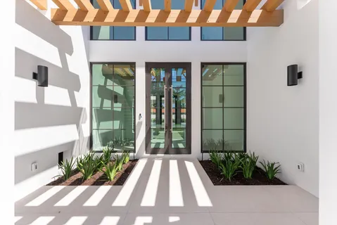 a kitchen with stainless steel appliances granite countertop a stove and a refrigerator