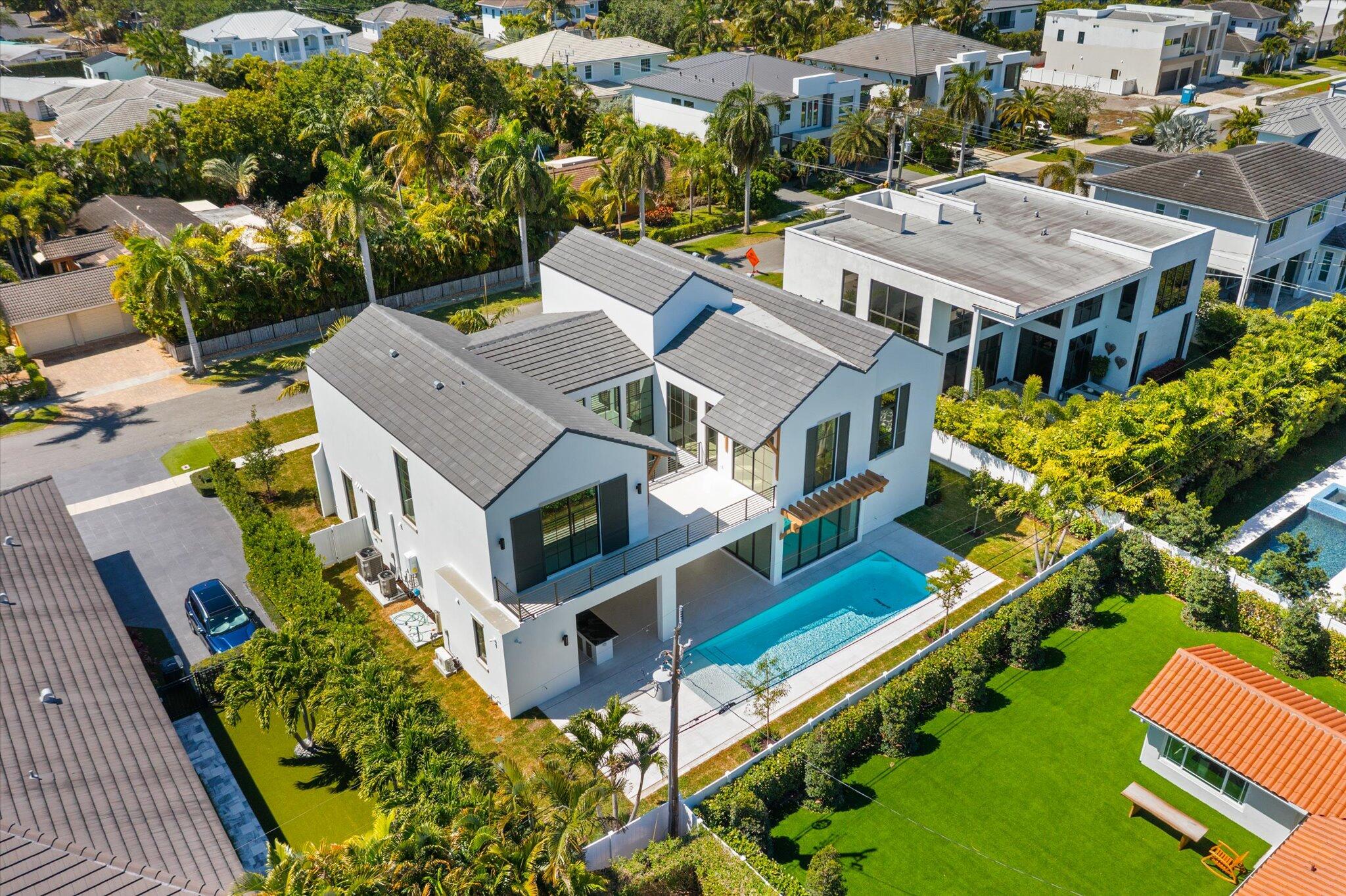 880 Northeast 3rd Avenue Boca Raton, FL 33432 - Photo 89 of 100 an aerial view of residential houses with yard