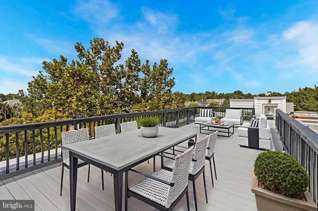 a view of a balcony with chairs