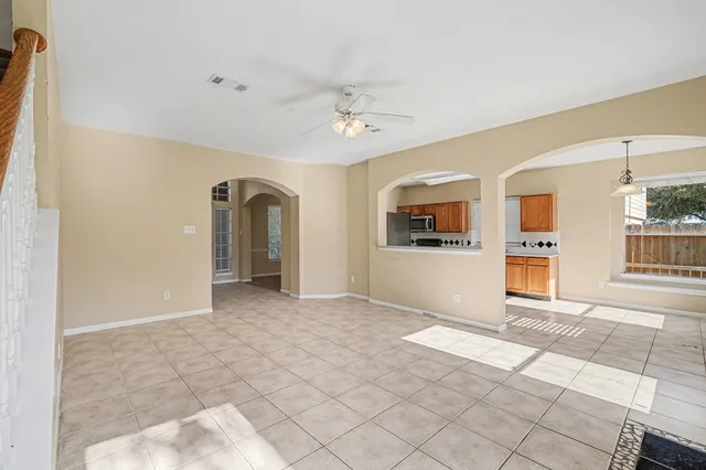a view of a big room with windows and cabinet