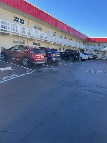 a view of parking with cars parked