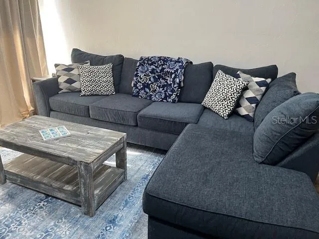 a living room with furniture and a couch