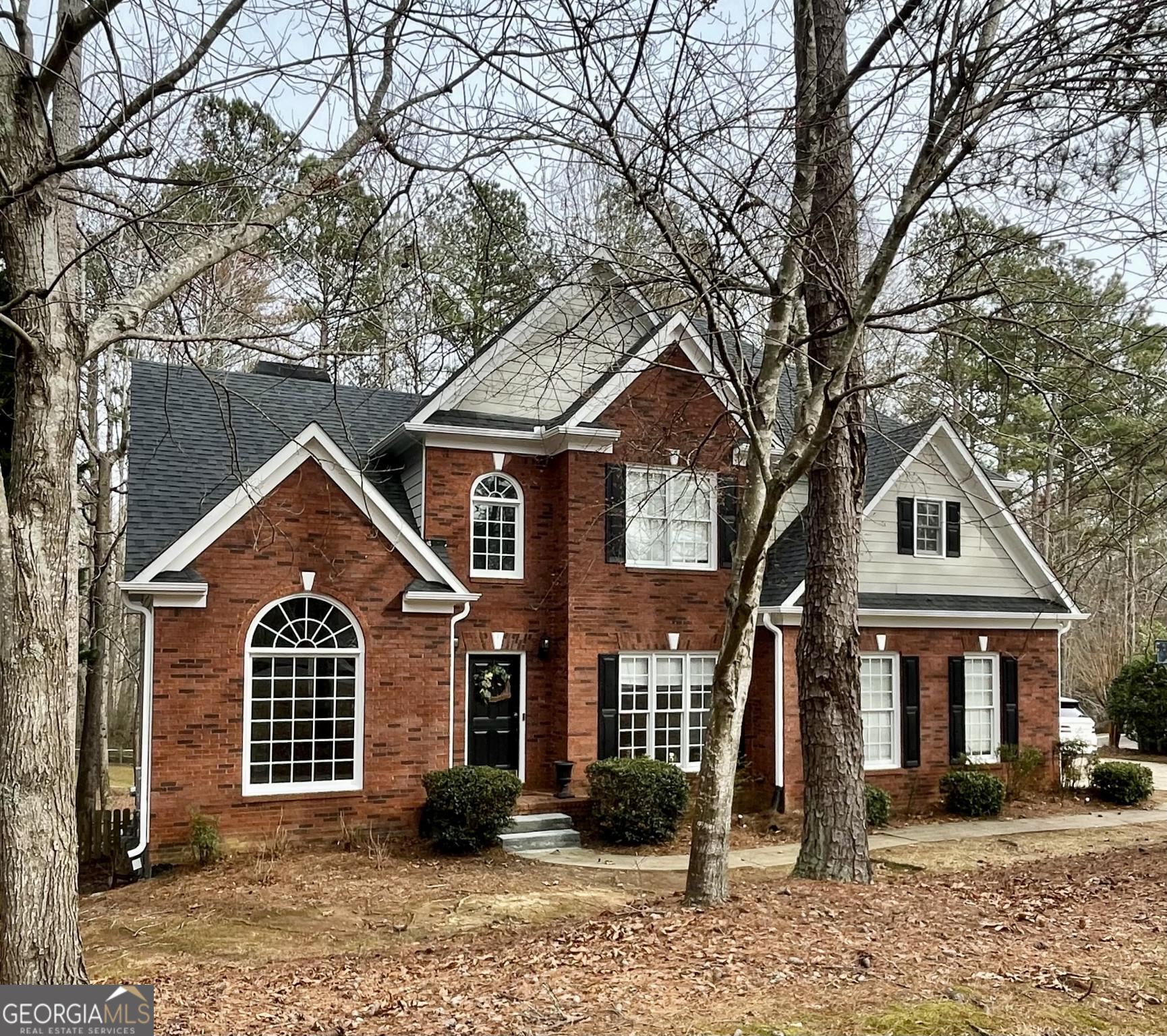 a front view of a house with a yard
