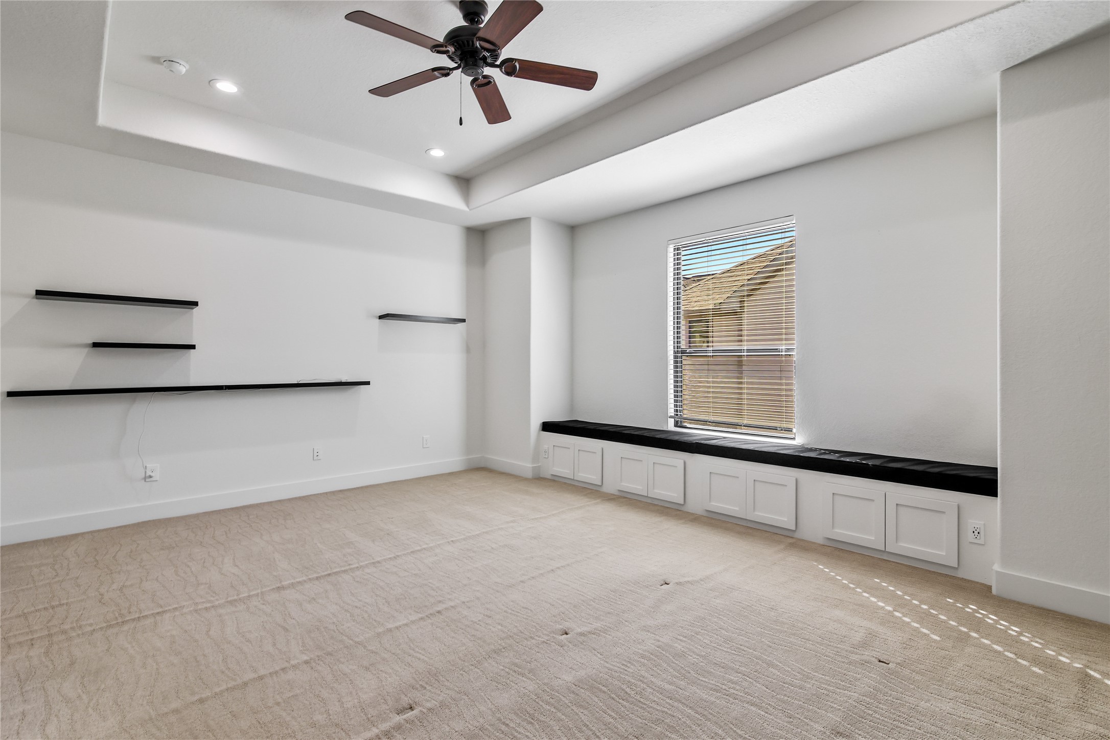 4231 Allen Street Houston, TX 77007 - Photo 24 of 31 Opposite view of the primary bedroom. Your tv or large piece of art will fit perfectly in the space between the shelving!