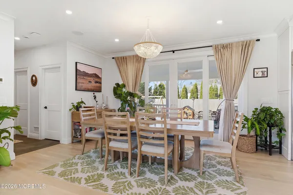 a living room with furniture window and a flat screen tv