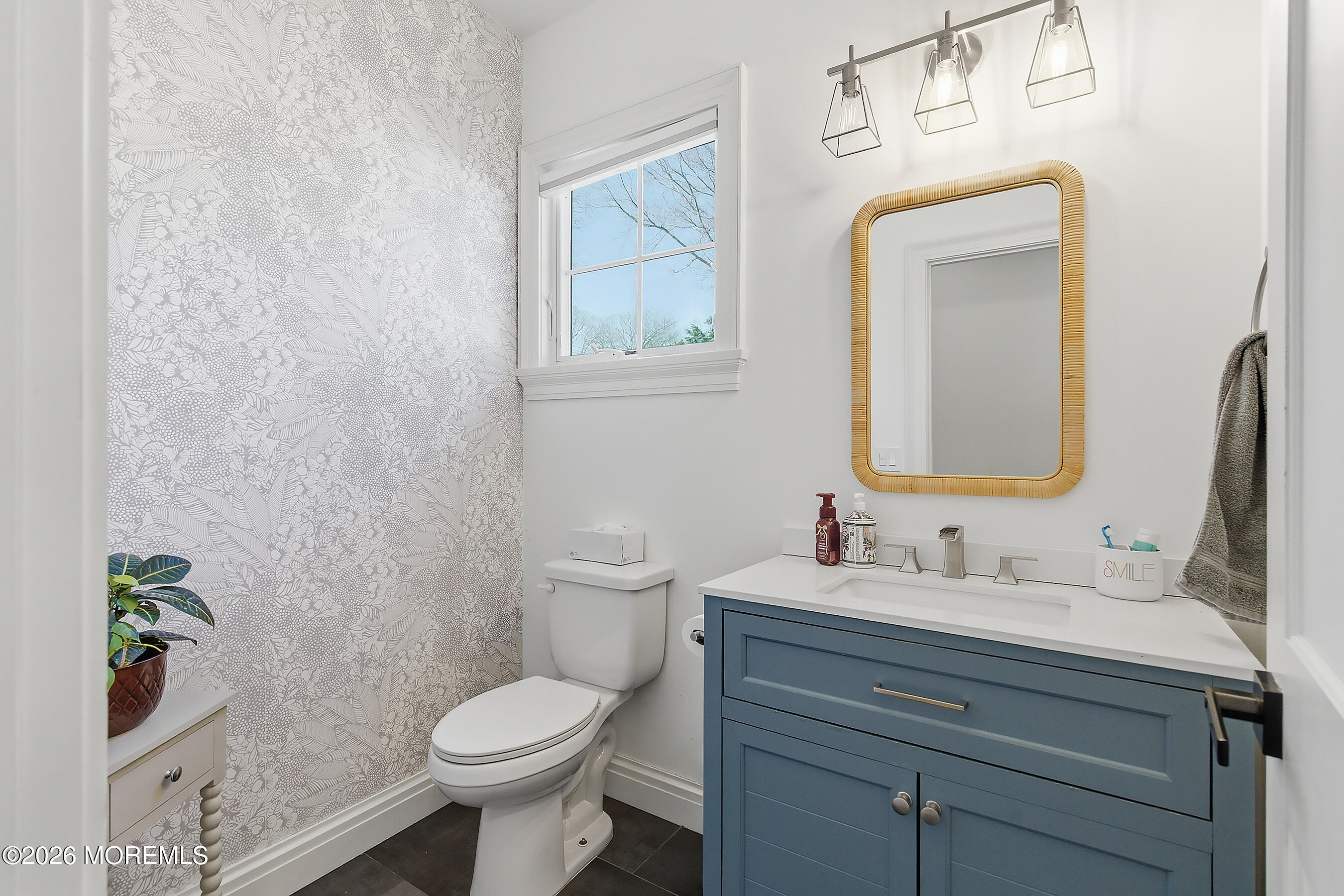 1603 Jackson Street Point Pleasant, NJ 08742 - Photo 12 of 45 a bathroom with a toilet sink and mirror