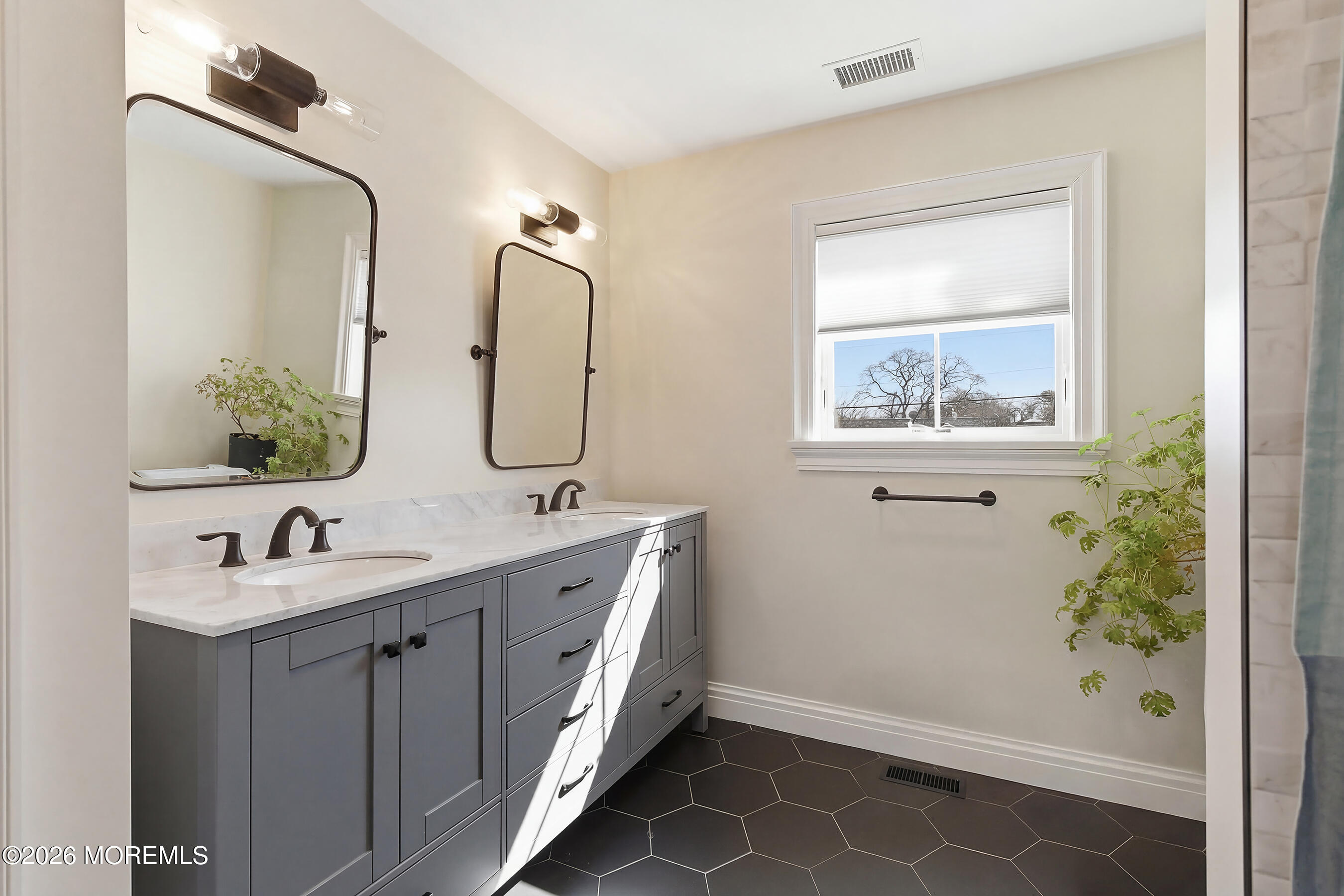 1603 Jackson Street Point Pleasant, NJ 08742 - Photo 23 of 45 a bathroom with a double vanity sink mirror and shower