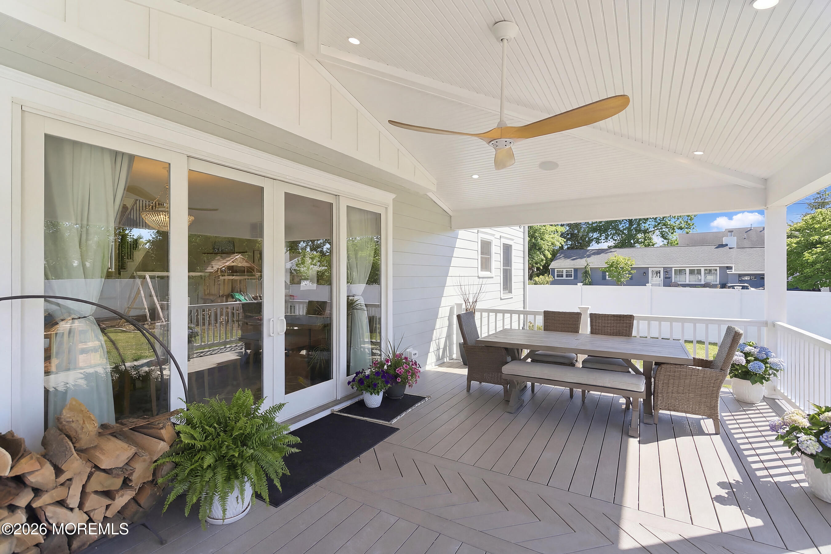 1603 Jackson Street Point Pleasant, NJ 08742 - Photo 27 of 45 a living room with furniture floor to ceiling window and wooden floor