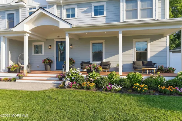 a kitchen with stainless steel appliances granite countertop a kitchen island a stove and a refrigerator