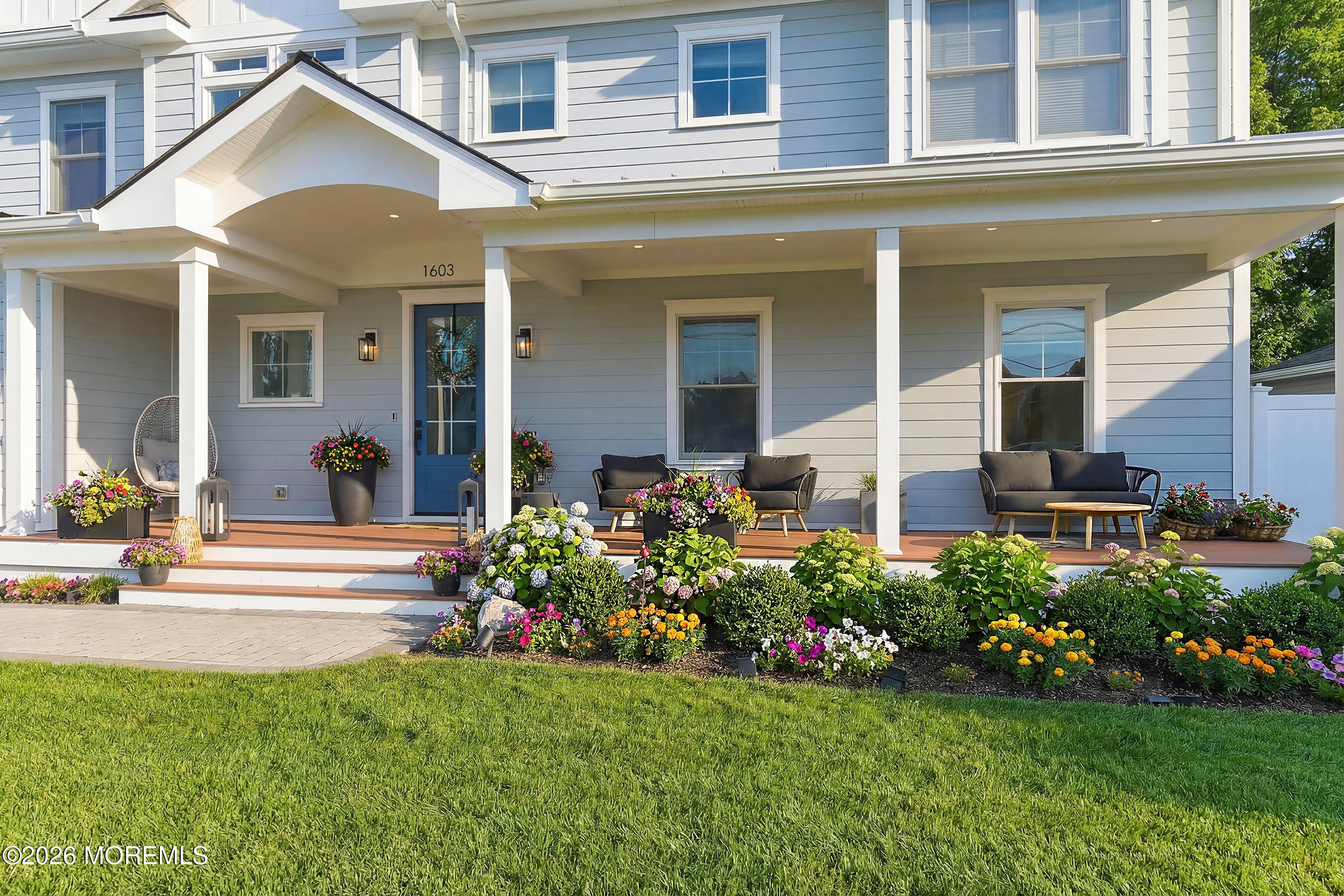 1603 Jackson Street Point Pleasant, NJ 08742 - Photo 3 of 45 a front view of a house with a garden