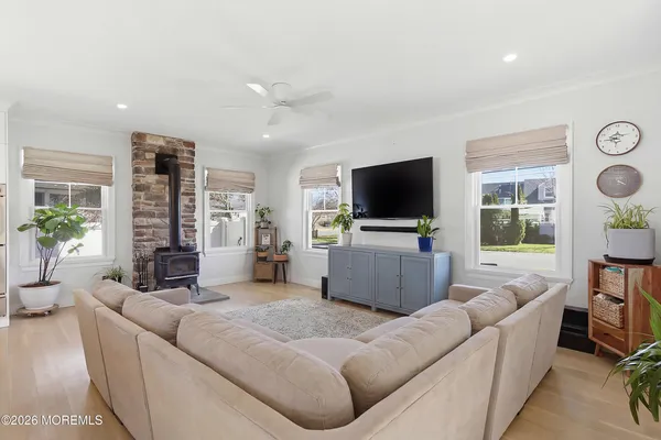 a living room with lots of furniture and kitchen view