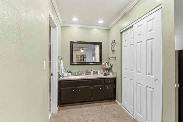 a bathroom with a glass shower door