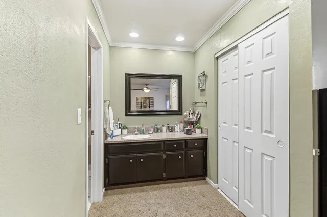a bathroom with a glass shower door